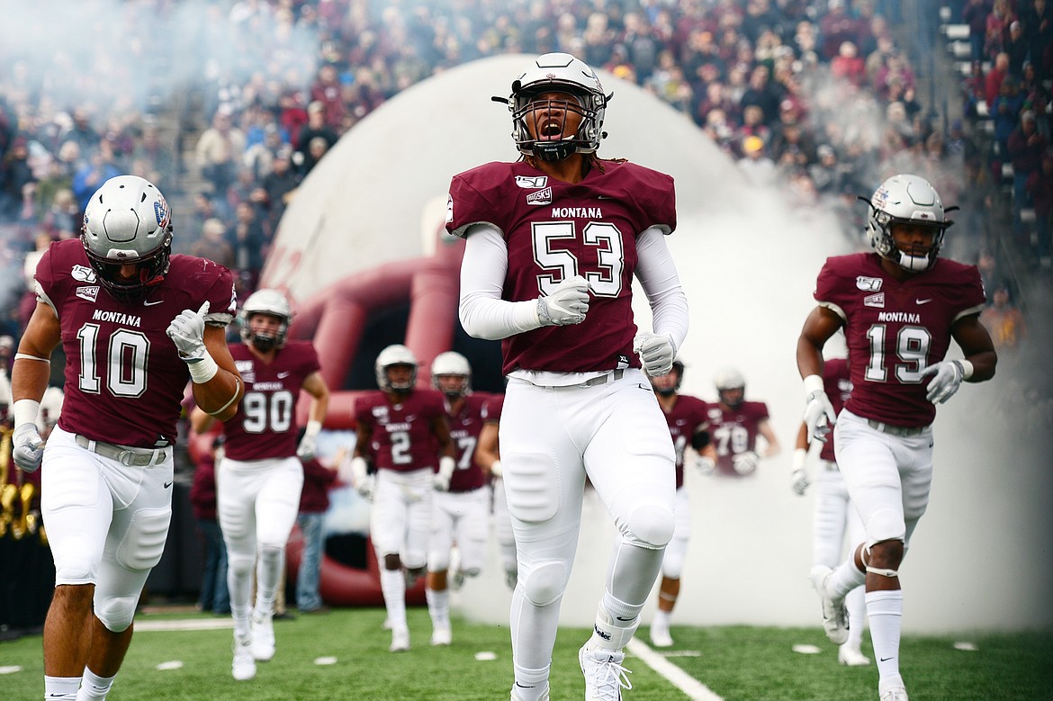 The Montana Grizzlies take the field before a matchup with Idaho at Washington-Grizzly Stadium on Saturday. (Casey Kreider/Daily Inter Lake)