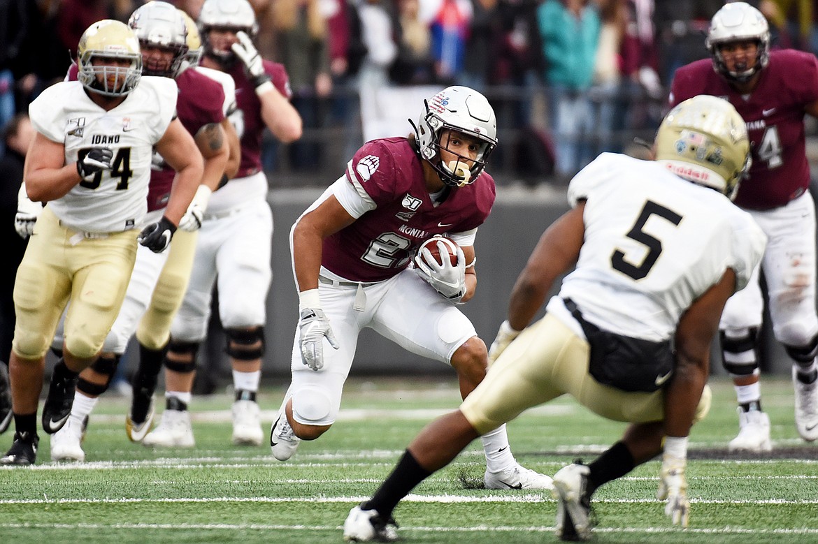 Montana running back Marcus Knight (21) makes a cut on a 26-yard reception in the fourth quarter against Idaho at Washington-Grizzly Stadium on Saturday. (Casey Kreider/Daily Inter Lake)