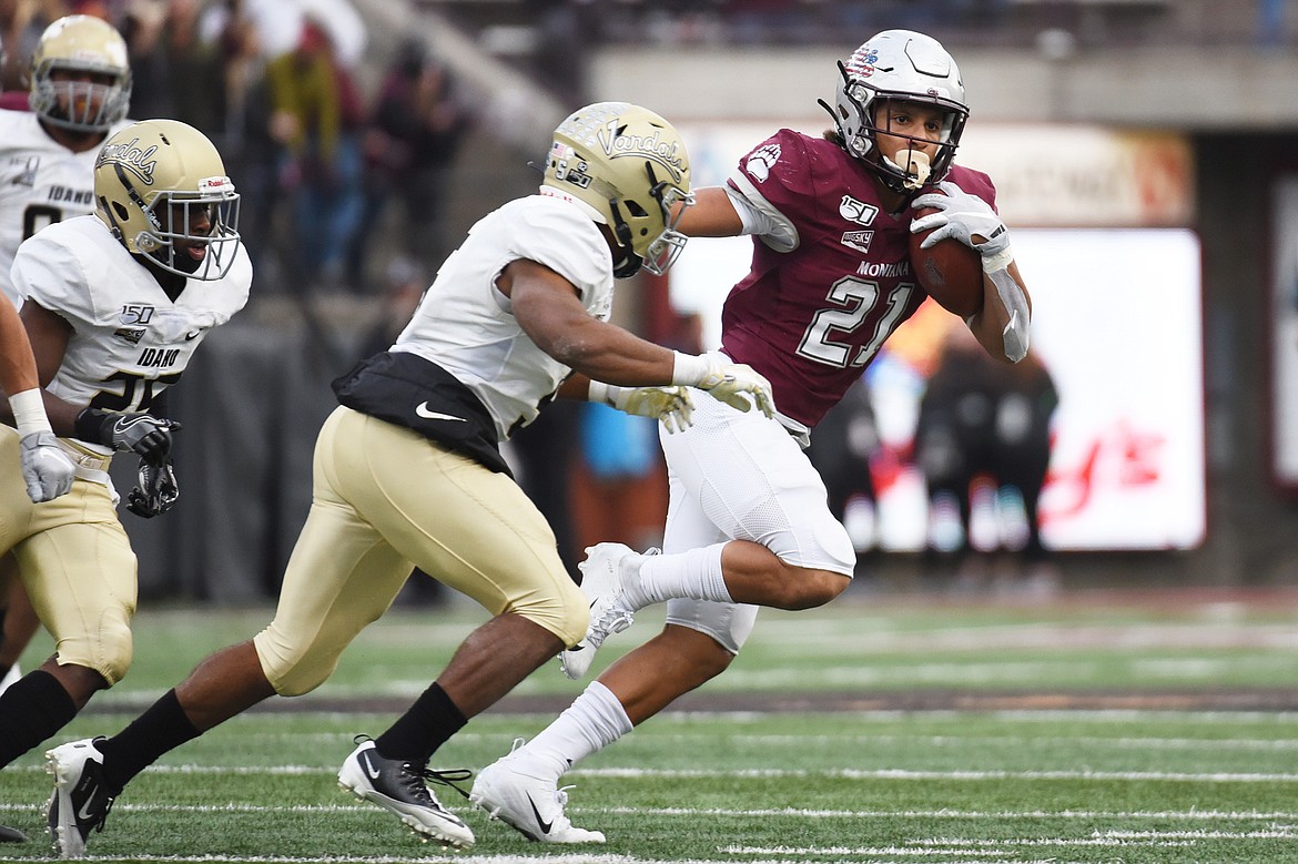 Montana running back Marcus Knight (21) looks to run on a 26-yard reception in the fourth quarter against Idaho at Washington-Grizzly Stadium on Saturday. (Casey Kreider/Daily Inter Lake)