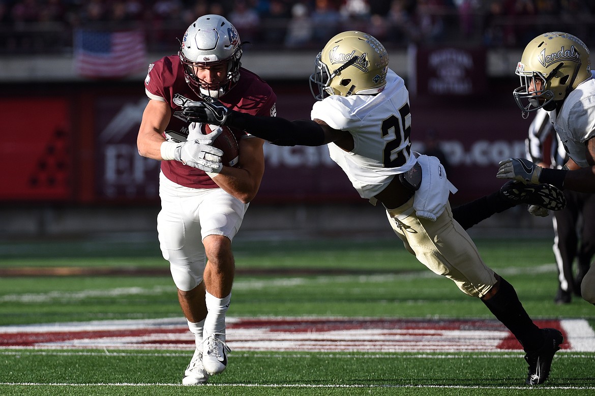 Montana wide receiver Mitch Roberts (80) is brought down by Idaho defensive back Jalen Hoover (25) on a 9-yard reception in the third quarter at Washington-Grizzly Stadium on Saturday. (Casey Kreider/Daily Inter Lake)