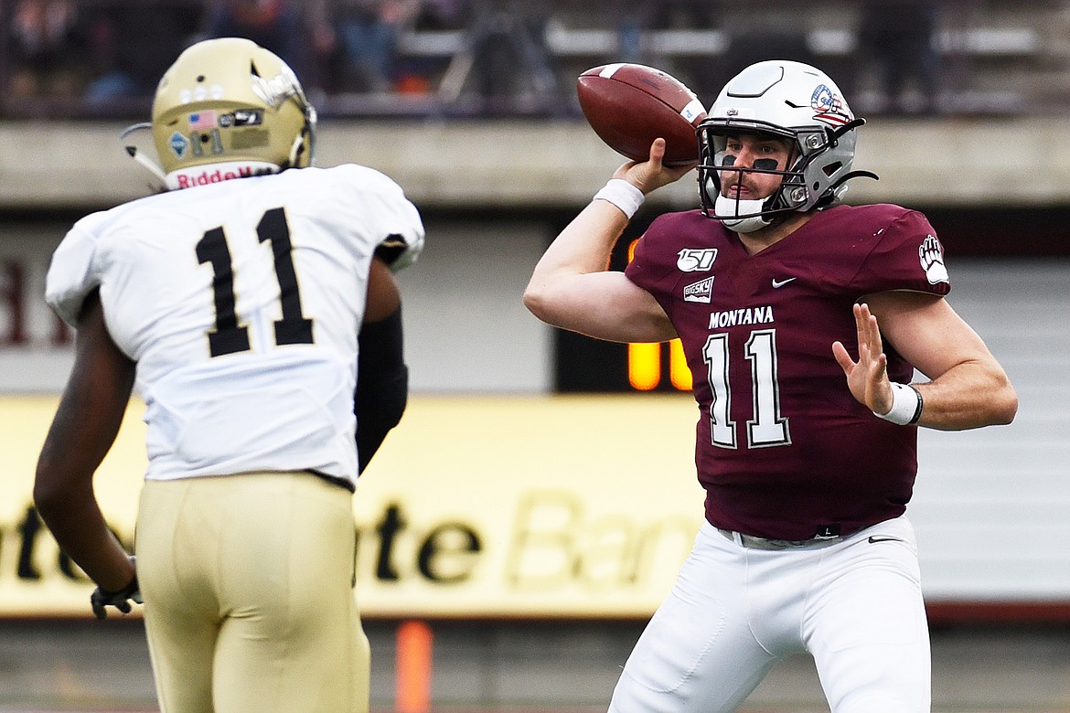 Montana quarterback Dalton Sneed (11) throws on the run in the fourth quarter against Idaho at Washington-Grizzly Stadium on Saturday. (Casey Kreider/Daily Inter Lake)