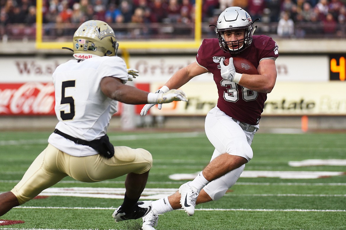 Montana running back Nick Ostmo (38) looks to get outside on an 11-yard reception in the third quarter against Idaho at Washington-Grizzly Stadium on Saturday. (Casey Kreider/Daily Inter Lake)