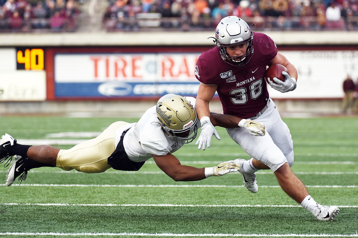 Montana running back Nick Ostmo (38) gets to the outside on an 11-yard reception in the third quarter against Idaho at Washington-Grizzly Stadium on Saturday. (Casey Kreider/Daily Inter Lake)