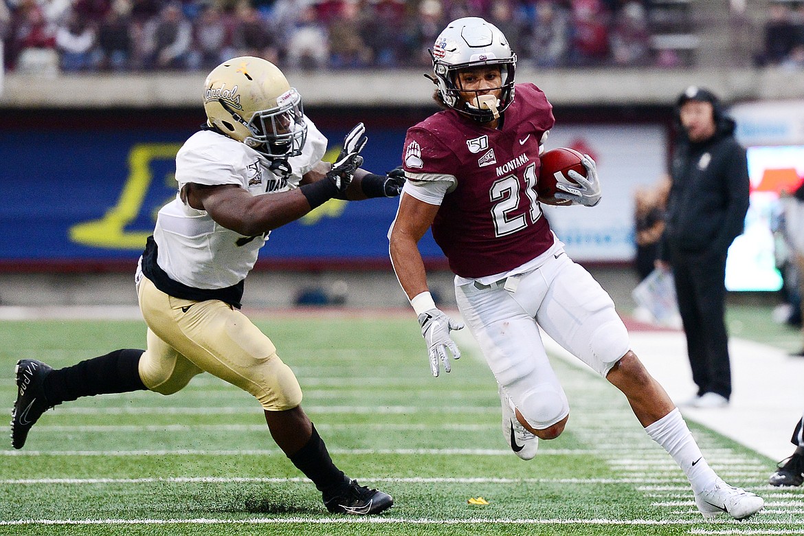 Montana Grizzlies running back Marcus Knight (21) gets around the edge on a fourth-quarter run against Idaho at Washington-Grizzly Stadium on Saturday. (Casey Kreider/Daily Inter Lake)