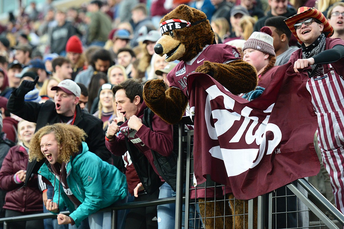 Griz fans cheer on the team with Monte as they play Idaho at Washington-Grizzly Stadium on Saturday. (Casey Kreider/Daily Inter Lake)
