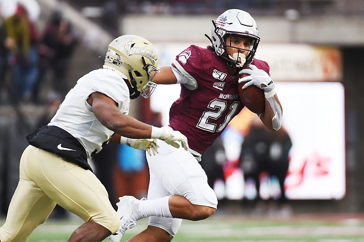 Montana running back Marcus Knight (21) looks to run on a 26-yard reception in the fourth quarter against Idaho at Washington-Grizzly Stadium on Saturday. (Casey Kreider/Daily Inter Lake)