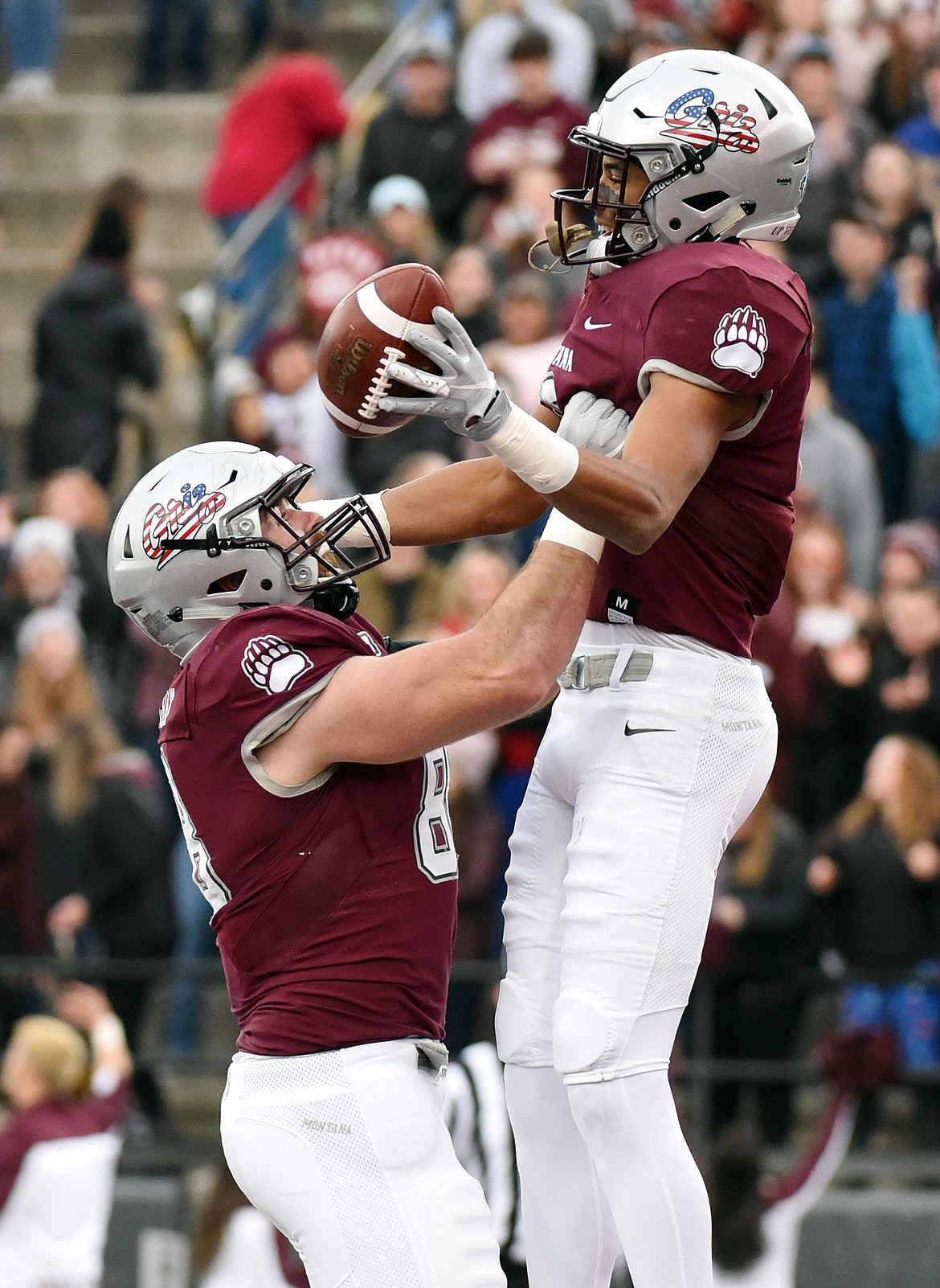 Montana wide receiver Samori Toure (8) is lifted up by tight end Colin Bingham (88) after Toure's 44-yard touchdown reception in the second quarter against Idaho at Washington-Grizzly Stadium on Saturday. (Casey Kreider/Daily Inter Lake)