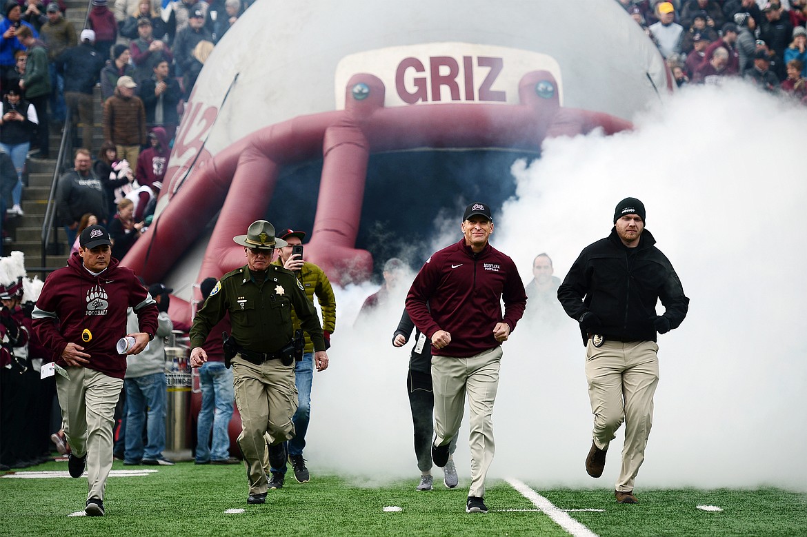 Montana Grizzlies head coach Bobby Hauck takes the field before a game against the Idaho Vandals at Washington-Grizzly Stadium on Saturday. (Casey Kreider/Daily Inter Lake)