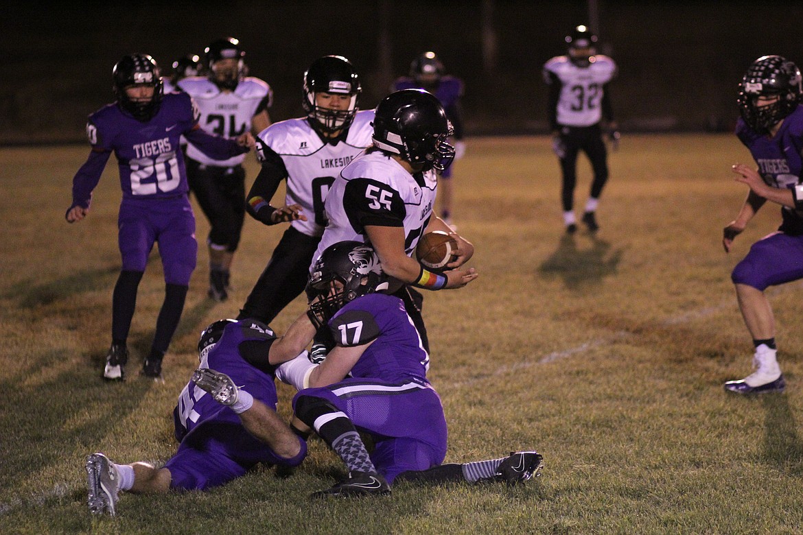 Photo by CHUCK BANDEL
Tigers Adam Ball and Ian Farris gang tackle a Lakeside runningback during the Knights&#146; lone possesion of the Kansas Tiebreaker that was played earlier this week.