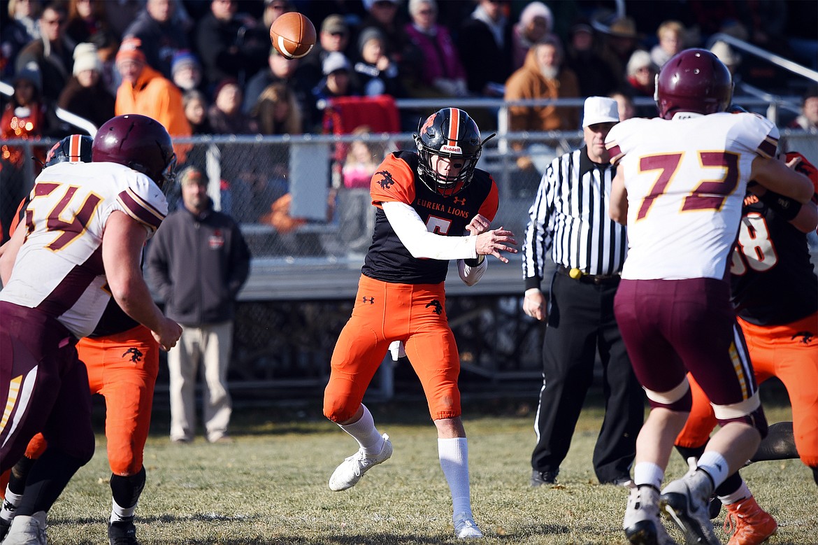 Eureka quarterback Hank Dunn (5) looks for an open receiver across the middle in the second quarter against Baker at Lincoln County High School in Eureka on Saturday. (Casey Kreider/Daily Inter Lake)