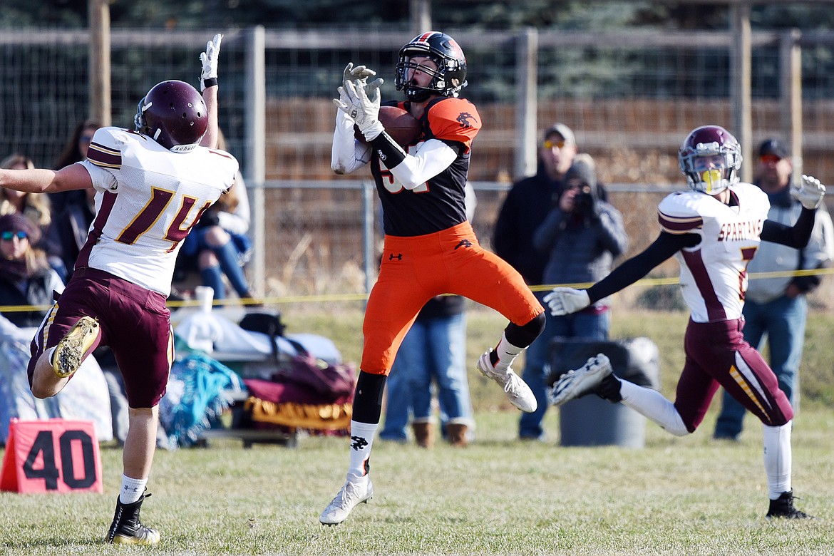 Eureka defensive back Grady Seal (57) pulls down an interception in the first quarter against Baker at Lincoln County High School in Eureka on Saturday. (Casey Kreider/Daily Inter Lake)