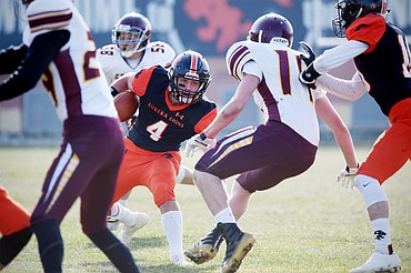 Eureka running back Chet McCully (4) bounces a run to the outside in the first quarter against Baker at Lincoln County High School in Eureka on Saturday. (Casey Kreider/Daily Inter Lake)