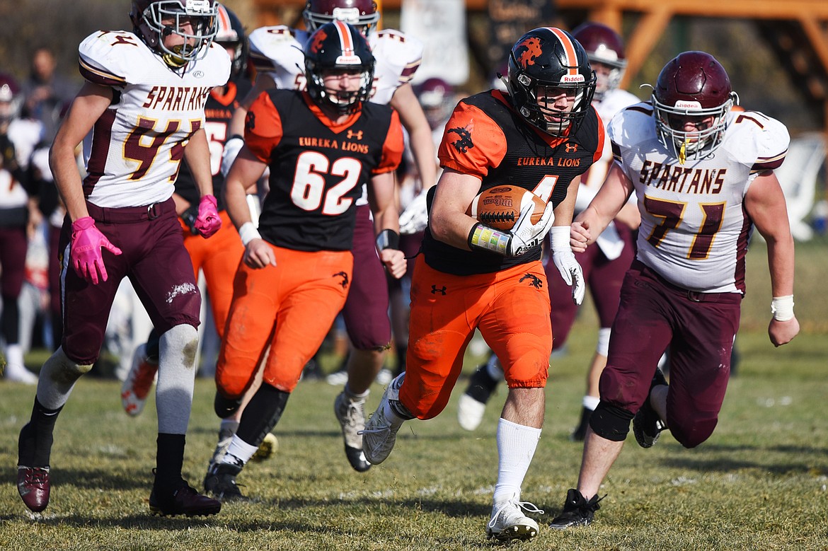 Eureka running back Chet McCully (4) heads to the end zone on a second quarter touchdown run against Baker at Lincoln County High School in Eureka on Saturday. (Casey Kreider/Daily Inter Lake)