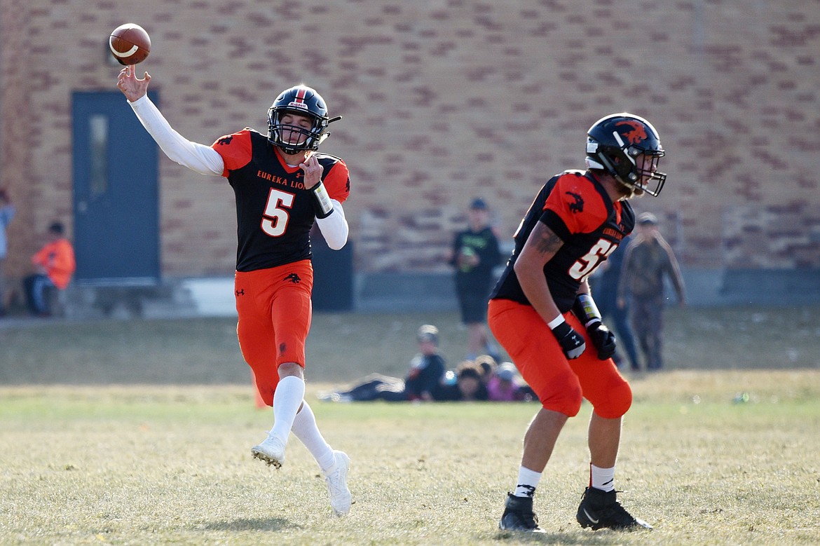 Eureka quarterback Hank Dunn (5) throws on the run in the first quarter against Baker at Lincoln County High School in Eureka on Saturday. (Casey Kreider/Daily Inter Lake)