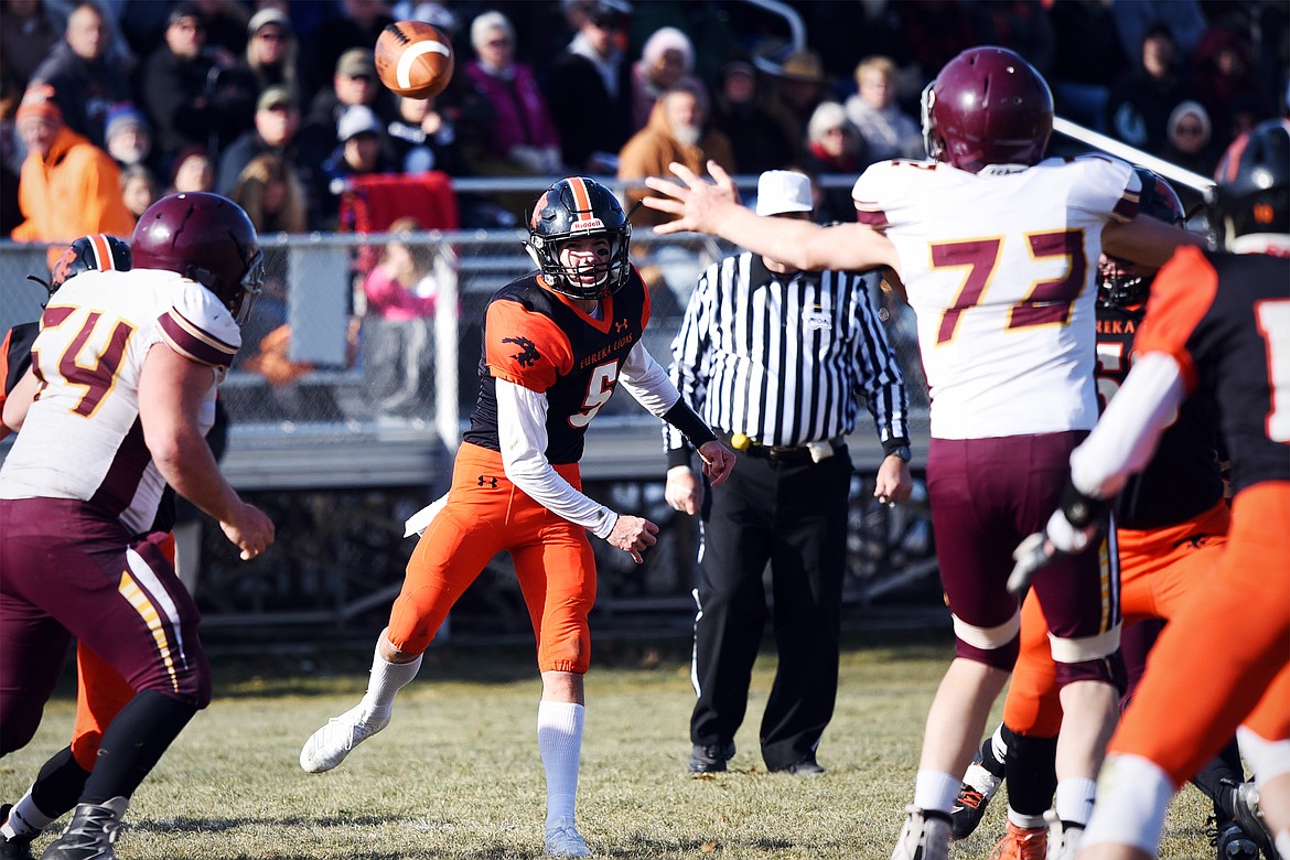 Eureka quarterback Hank Dunn (5) looks for an open receiver across the middle in the second quarter against Baker at Lincoln County High School in Eureka on Saturday. (Casey Kreider/Daily Inter Lake)