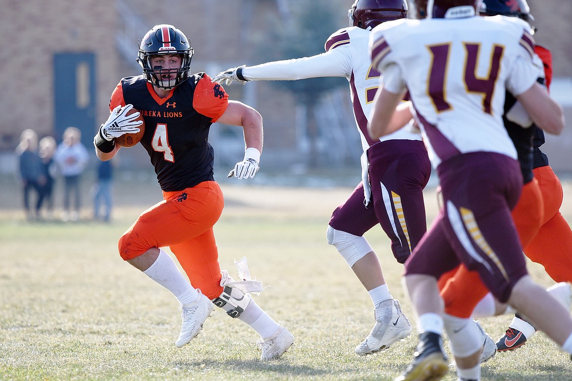 Eureka running back Chet McCully (4) looks for room to run in the first quarter against Baker at Lincoln County High School in Eureka on Saturday. (Casey Kreider/Daily Inter Lake)