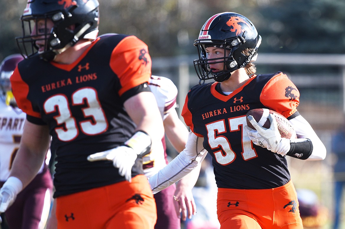 Eureka defensive back Grady Seal (57) returns an interception in the first quarter against Baker at Lincoln County High School in Eureka on Saturday. (Casey Kreider/Daily Inter Lake)