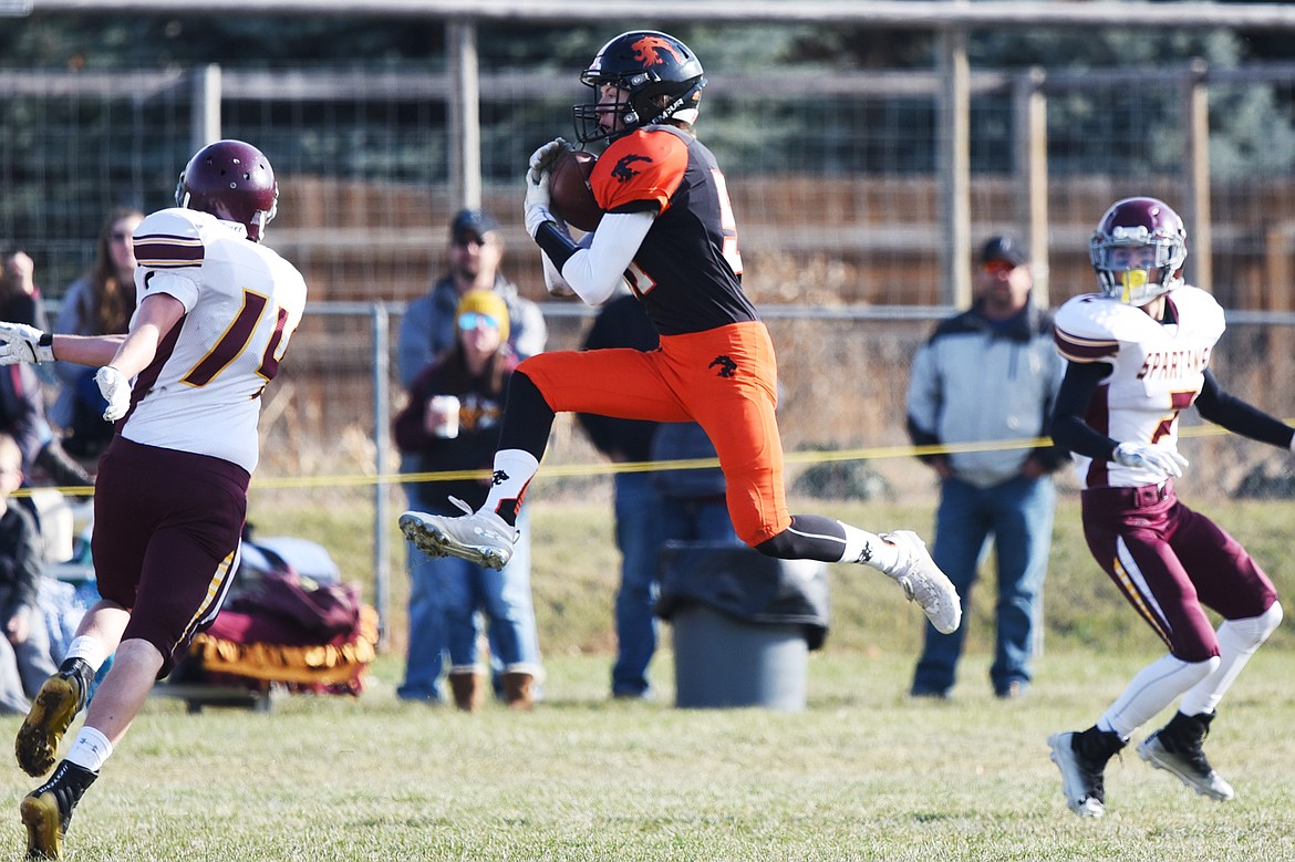 Eureka defensive back Grady Seal (57) pulls down an interception in the first quarter against Baker at Lincoln County High School in Eureka on Saturday. (Casey Kreider/Daily Inter Lake)