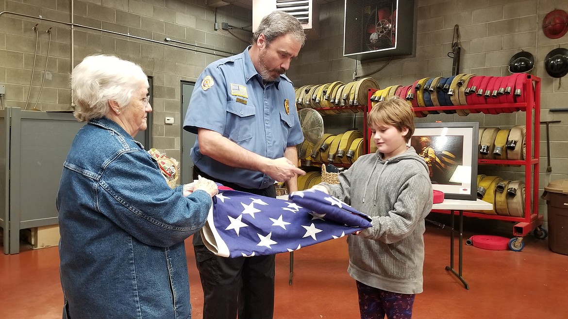 Photo by MANDI BATEMAN
Audience members had the opertunity to try their hand at properly folding the flag.