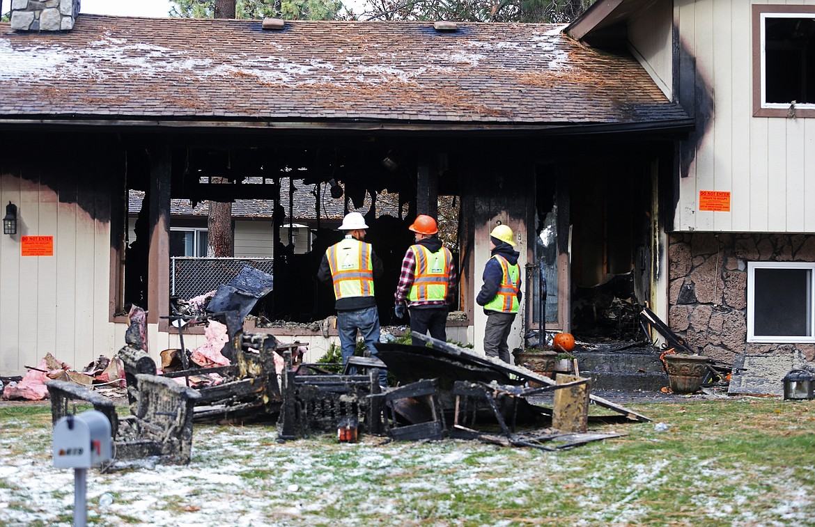 LOREN BENOIT/Press
An early morning fire destroyed half of a home on Pine Hill Drive in Coeur d&#146;Alene Thursday morning. The accidental fire started when an ash box was emptied from the wood stove into a plastic bucket on the house deck. The fire claimed the life of a dog. No one was injured.