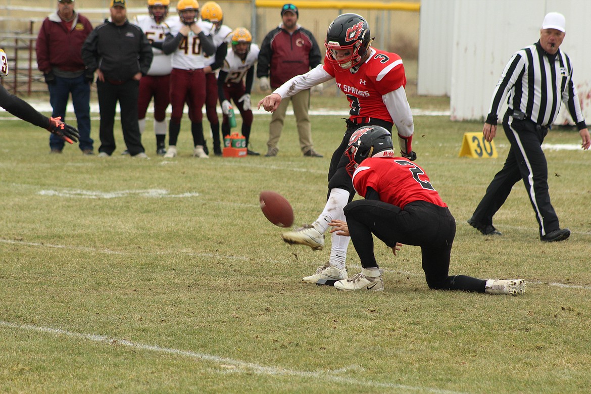 JACK MCALLISTER, with a helping hand from Lincoln Slonaker, kicks off last Saturday afternoon. (John Dowd/Clark Fork Valley Press)