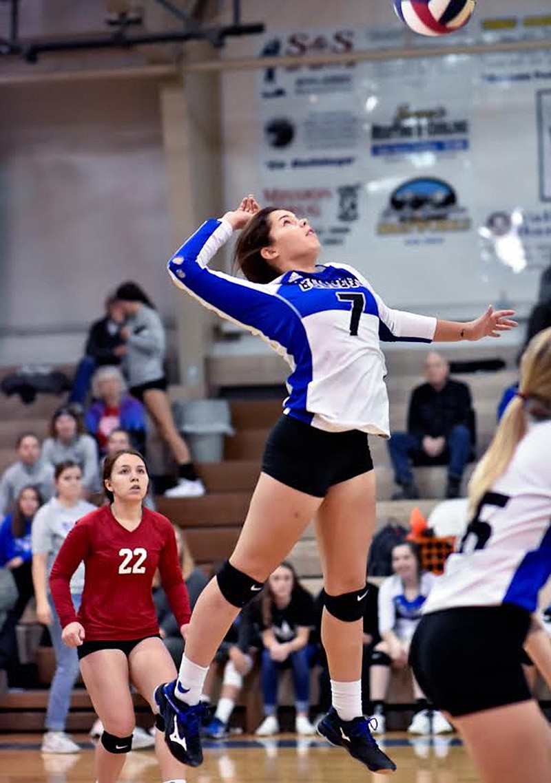 Mission's Azia Umphrey (7) adds some mustard to a back row kill shot that scored the final point in the fourth set against Bigfork for the third place consolation match win. (Photo courtesy of Christa Umphrey, Forward Photography)