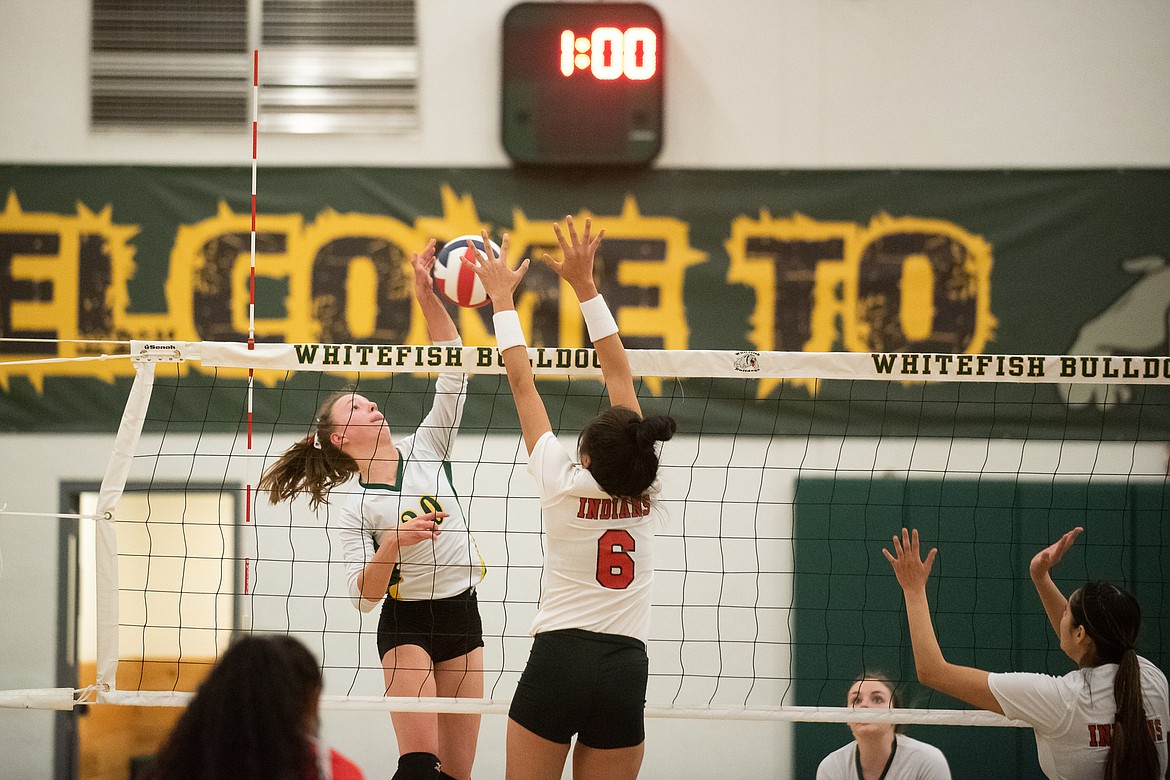 Mikenna Ells rises to the net during Monday's play-in win over Browning. (Daniel McKay/Whitefish Pilot)