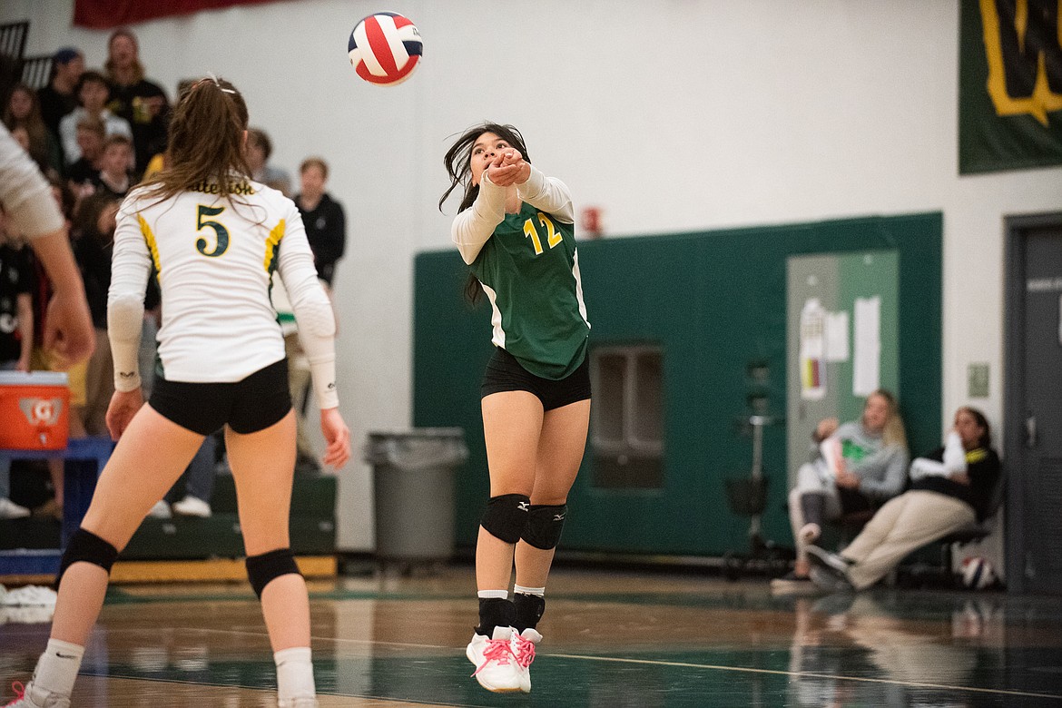 Jasmine Matern extends for the bump during Monday's play-in win over Browning. (Daniel McKay/Whitefish Pilot)