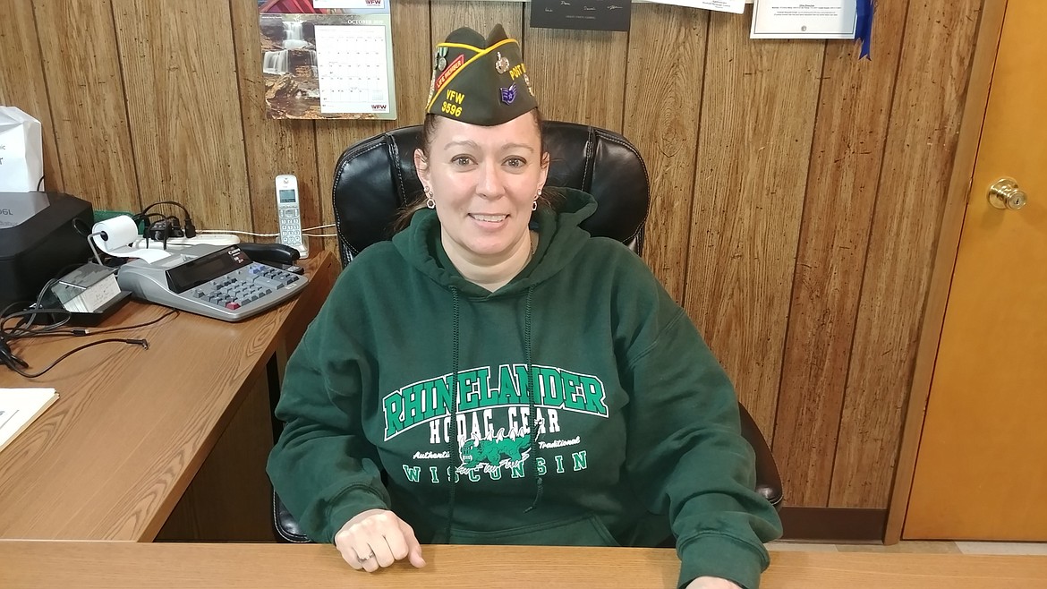 Heather Allen sits at her desk at the Veterans of Foreign Wars in Plains recently. Allen served her country in the U.S. Air Force working in the intelligence field. (Chuck Bandel/Valley Press)