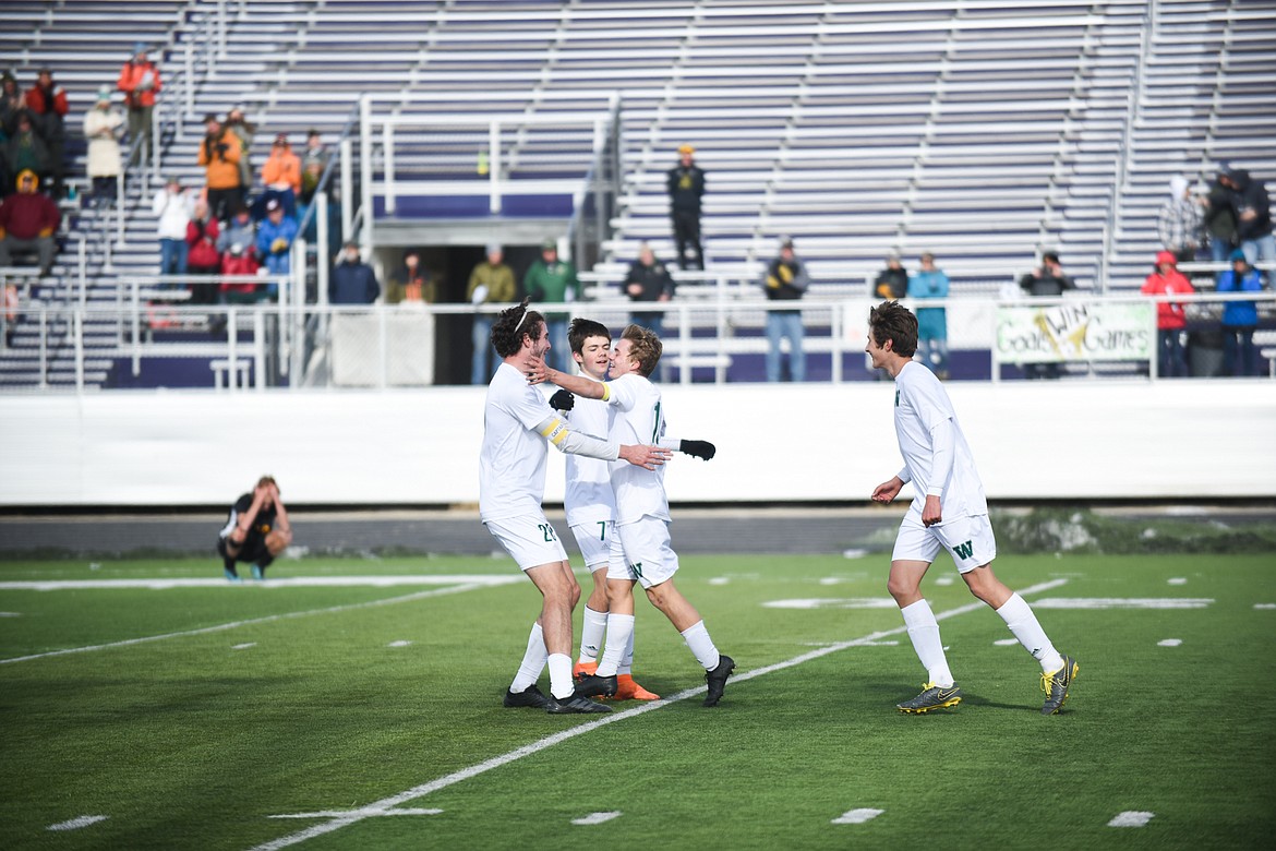 Casey Schneider celebrates with his teammates during the Bulldogs&#146; 4-0 state title win over Laurel . (Daniel McKay/Whitefish Pilot)