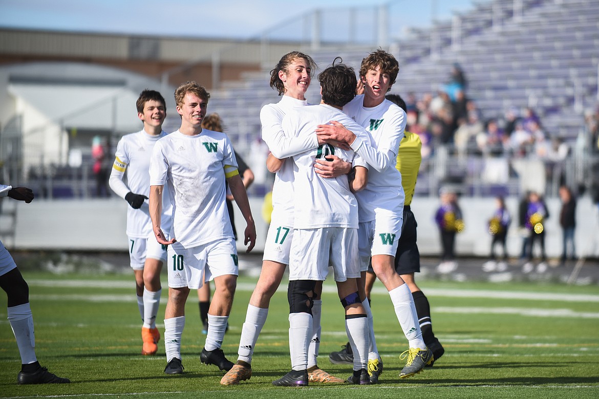 The Bulldogs celebrate Josh Gunderson&#146;s late penalty kick during the Bulldogs&#146; 4-0 state title win over Laurel Saturday in Laurel. (Daniel McKay/Whitefish Pilot)