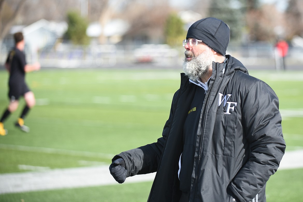 John Lacey watches his team during the Bulldogs&#146; 4-0 state title win over Laurel . (Daniel McKay/Whitefish Pilot)