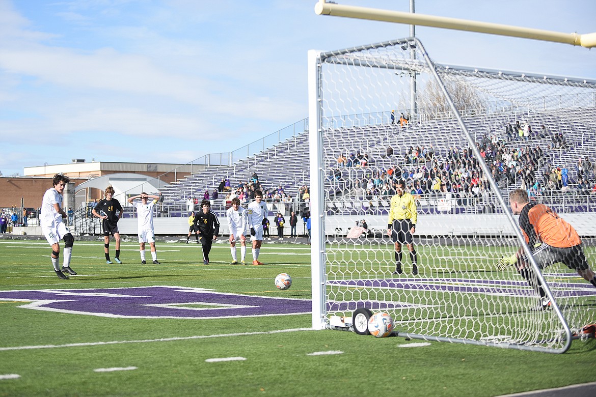 Josh Gunderson fires off a penalty kick during the Bulldogs&#146; 4-0 state title win over Laurel . (Daniel McKay/Whitefish Pilot)