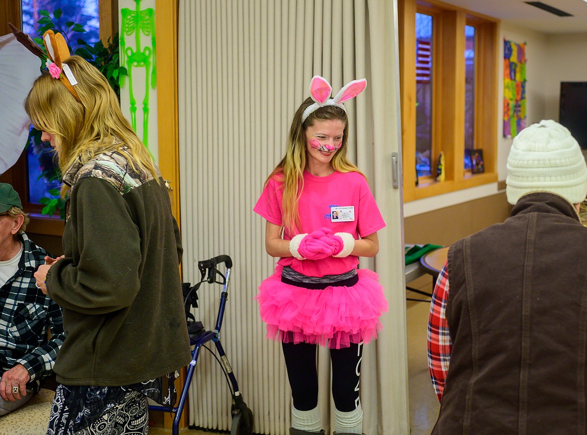 Staffer Jessica Goodnight greets trick or treaters.