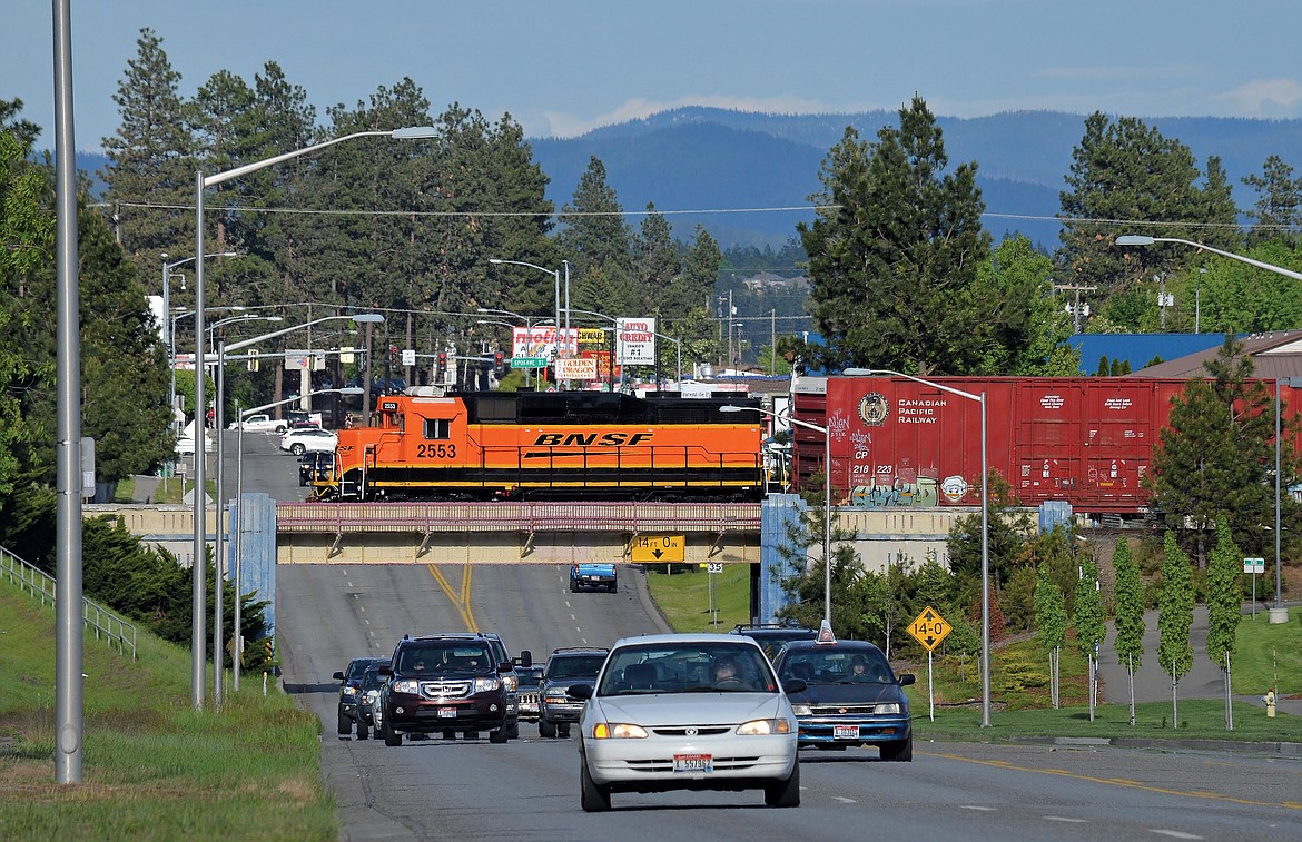 BRUCE KELLY/Courtesy
BNSF Railway&#146;s once-a-week train crosses Seltice Way in Post Falls after gathering lumber cars from the Plummer Forest Products and Idaho Veneer mills. Elsewhere in the city, trains are required to honk where they cross streets at the same elevation.