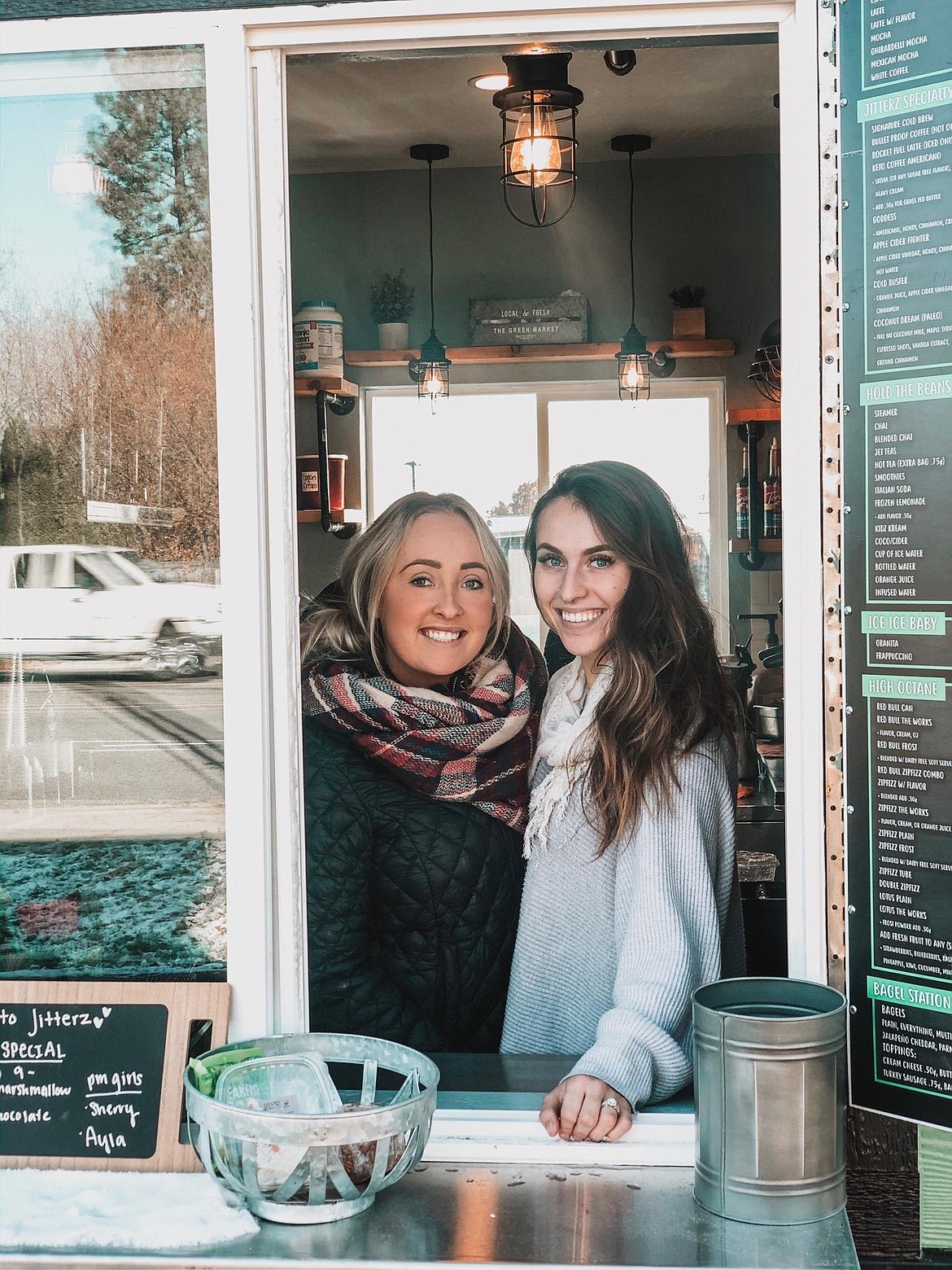 Employees Kelsey Creamer, left, and Ayla Jelinek at the new Jitterz Espresso stand in the Prairie Avenue food court.