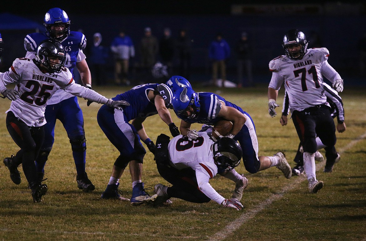 Coeur d&#146;Alene running back Trent Elstad rushes the ball near the sideline against Highland.