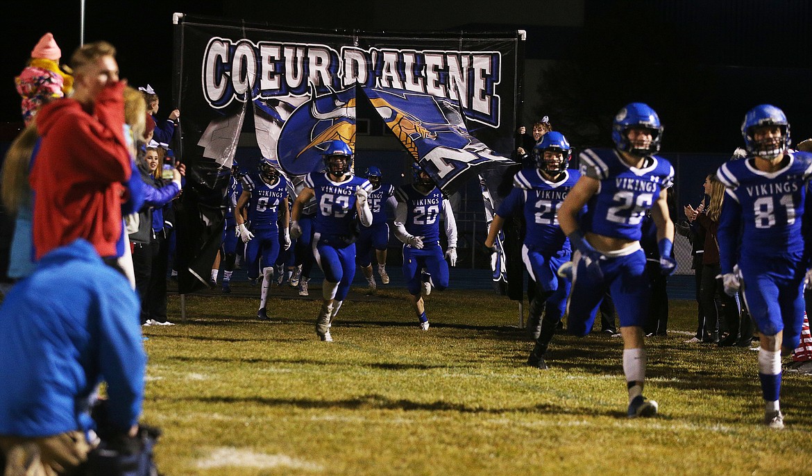 Coeur d&#146;Alene&#146;s football team returns to the field for the second half of Friday night&#146;s semifinal game against Highland at Viking Field. (LOREN BENOIT/Press)