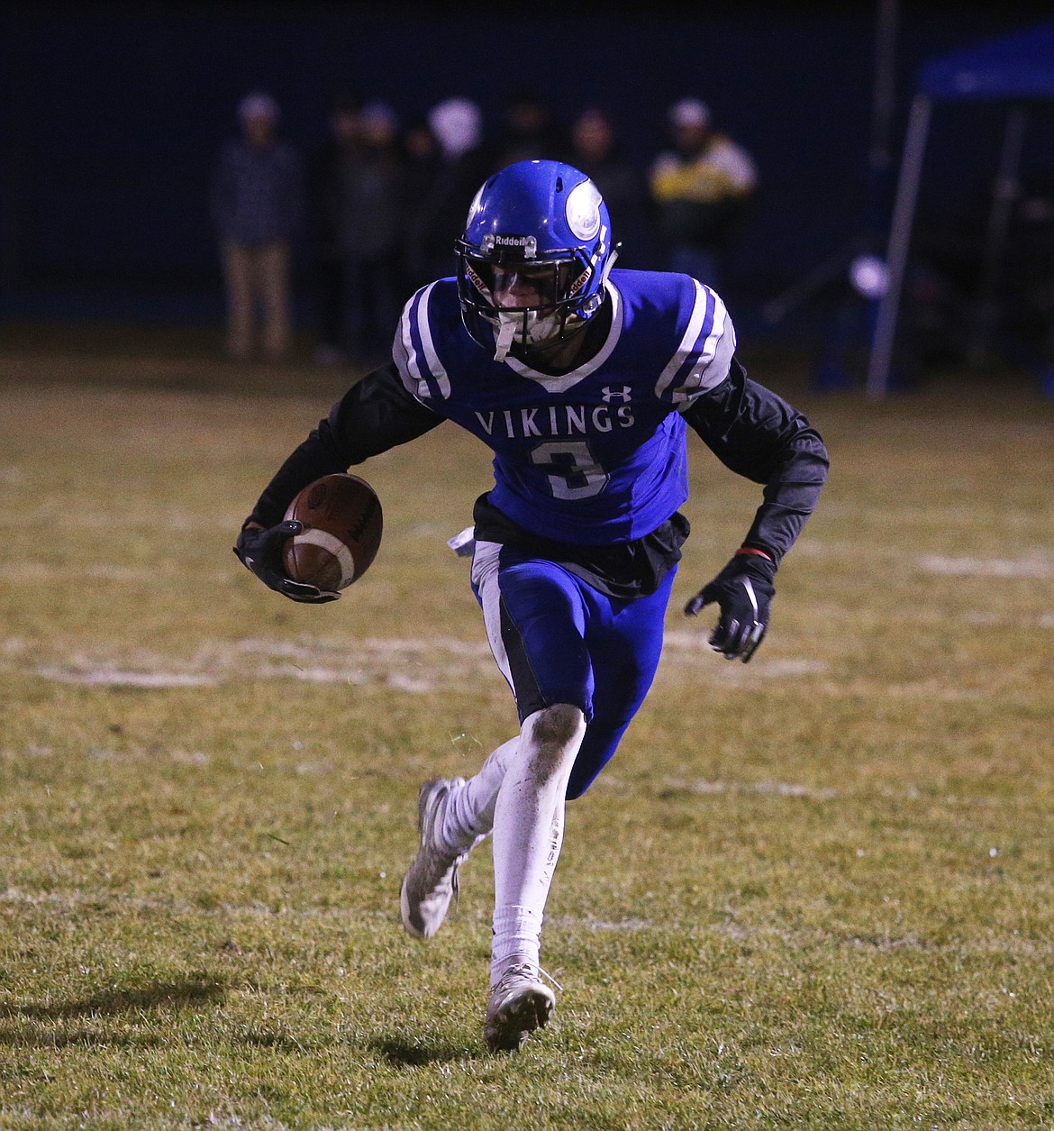 Coeur dAlenes Jake Brown catches the ball and runs upfield against Highland during Friday nights game at Viking Field. (LOREN BENOIT/Press)