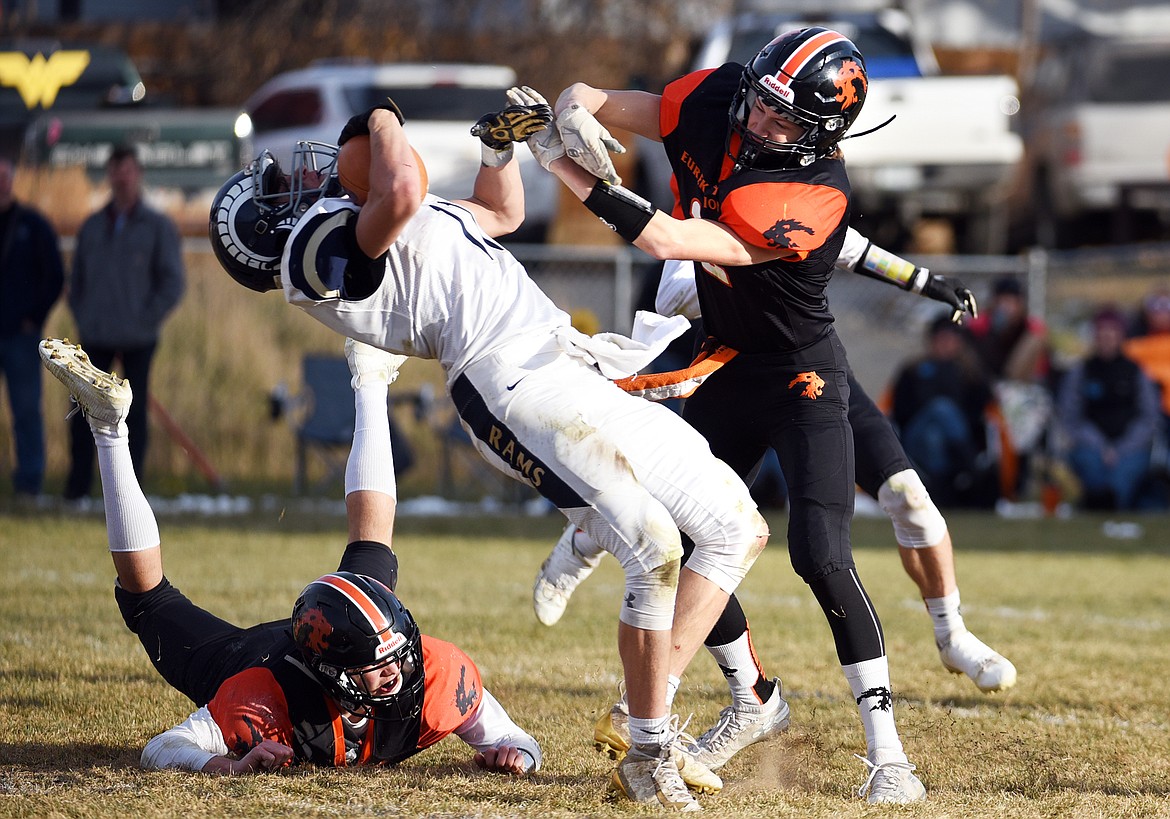 Eureka defensive back Grady Seal (2) lowers his shoulder into Red Lodge wide receiver Braden Tomlin (11) after a reception in the third quarter in the State Class B semifinal at Lincoln County High School in Eureka on Saturday. Eureka won, 39-35. (Casey Kreider/Daily Inter Lake)