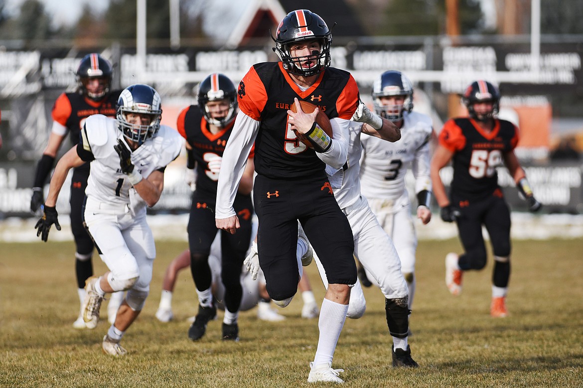 Eureka quarterback Hank Dunn (5) heads to the end zone on a 39-yard touchdown run in the first quarter against Red Lodge in the State Class B semifinal at Lincoln County High School in Eureka on Saturday. Eureka won, 39-35. (Casey Kreider/Daily Inter Lake)