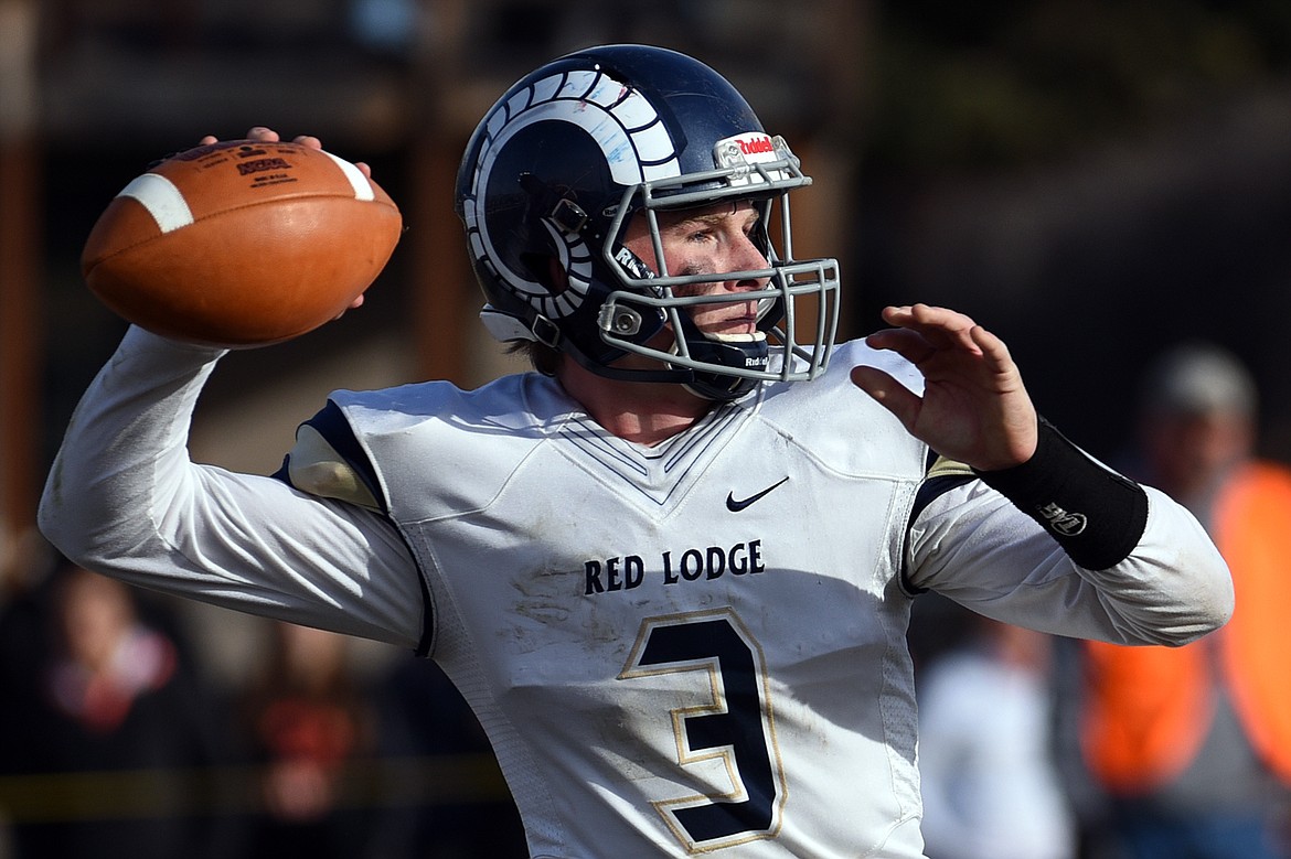 Red Lodge quarterback Austin Heimer (3) looks to throw against Eureka in the State Class B semifinal at Lincoln County High School in Eureka on Saturday. Eureka won, 39-35. (Casey Kreider/Daily Inter Lake)