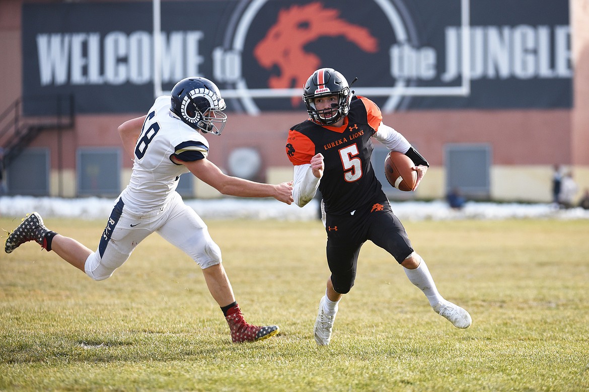 Eureka quarterback Hank Dunn (5) scores on a 2-yard touchdown run in the second quarter against Red Lodge in the State Class B semifinal at Lincoln County High School in Eureka on Saturday. Eureka won, 39-35. (Casey Kreider/Daily Inter Lake)