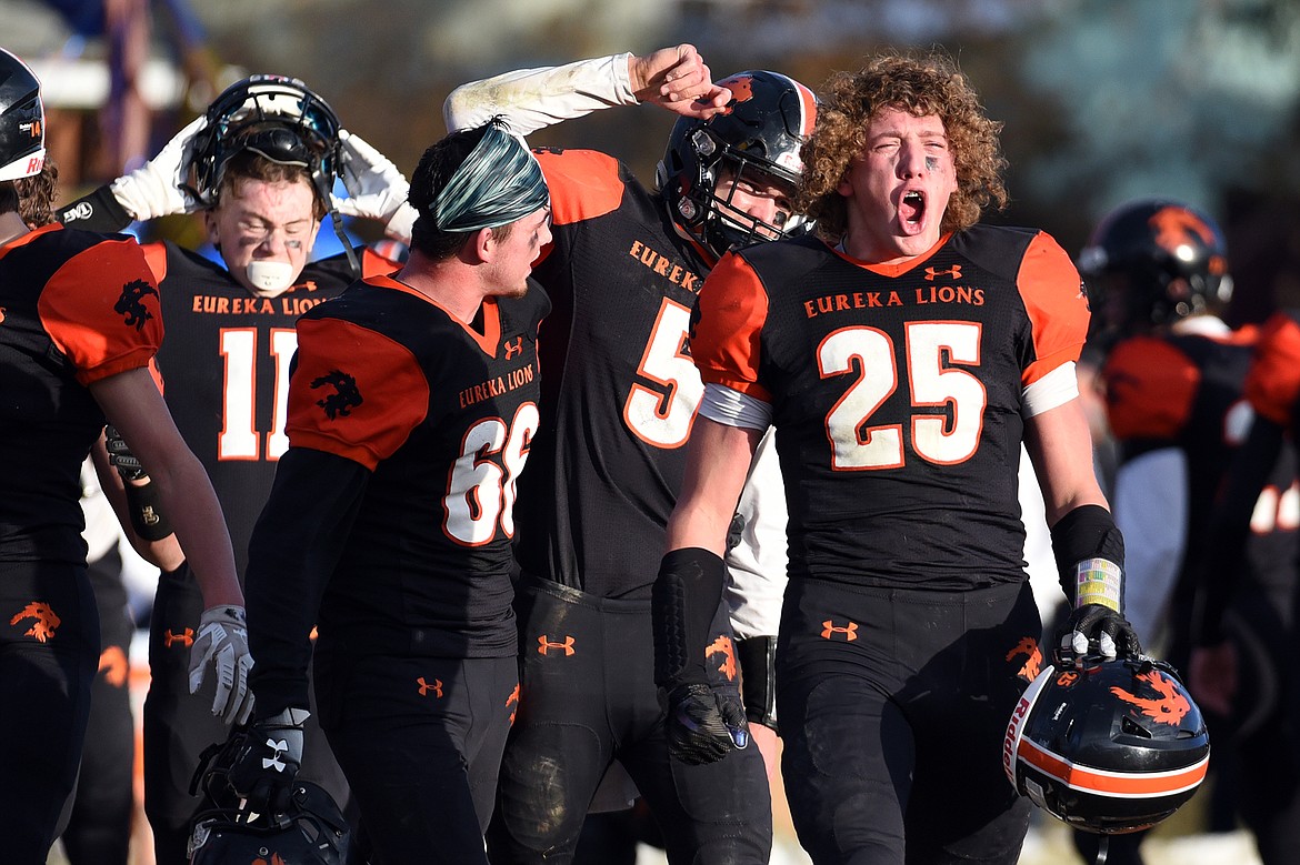 Eureka's Cory Chaney (25) celebrates after the Lions' 39-35 win over Red Lodge in the State Class B semifinal at Lincoln County High School in Eureka on Saturday. (Casey Kreider/Daily Inter Lake)