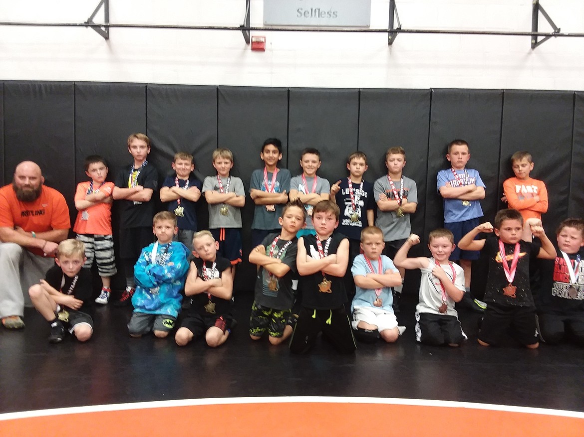 Courtesy photo
Post Falls Wrestling Club placers at the recent Team Real Life wrestling tournament are, front row from left, Colter Nagrone 1st, Rowen Moore 2nd, Brandin Colglazier 1st, Shea Tripp 1st, Jude Rollan Zender 1st, Knox Kjar 3rd, Jason Anderson 3rd, Tommy Bastedo 3rd and Luke Thompson 2nd; and back row from left, coach Pete Reardon, Ashton Campbell 2nd, Kyle Washburn 2nd, Brayson Moore 1st, Reise Reardon 1st, Gurnoor Gill 3rd, Trayson Blodgett 3rd, Tristan Mendenhall 1st, Ryker Allen 1st, Samson Kjar 1st and Parker Bundy 3rd. Other placers not pictured are James Genatone 1st, Paxton Purcell 1st, Gavin Rodriguez 3rd and Wyatt Drywater 1st.