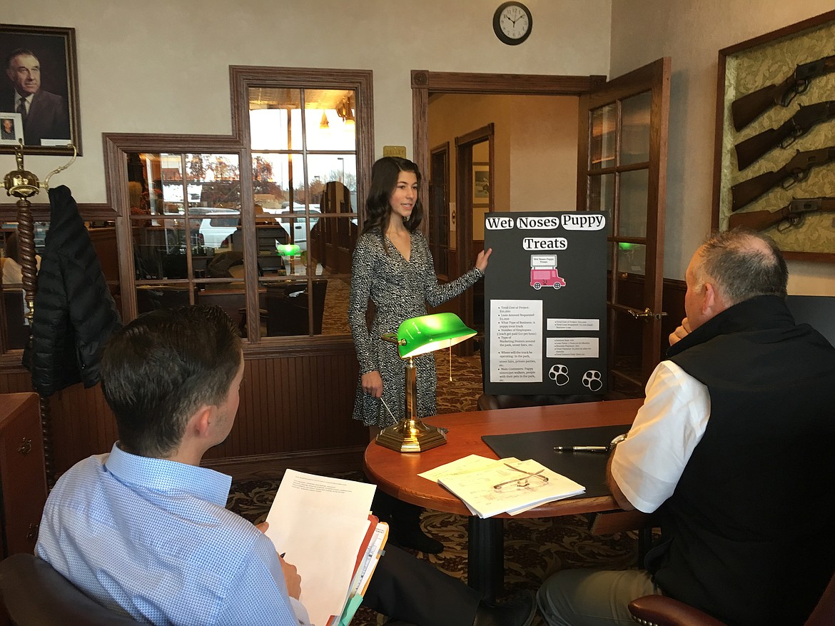 Lauren Welch presents her business idea to Logan Hensley and Mark Hensley of Valley Bank. (Photos courtesy of St. Matthew&#146;s Catholic School)