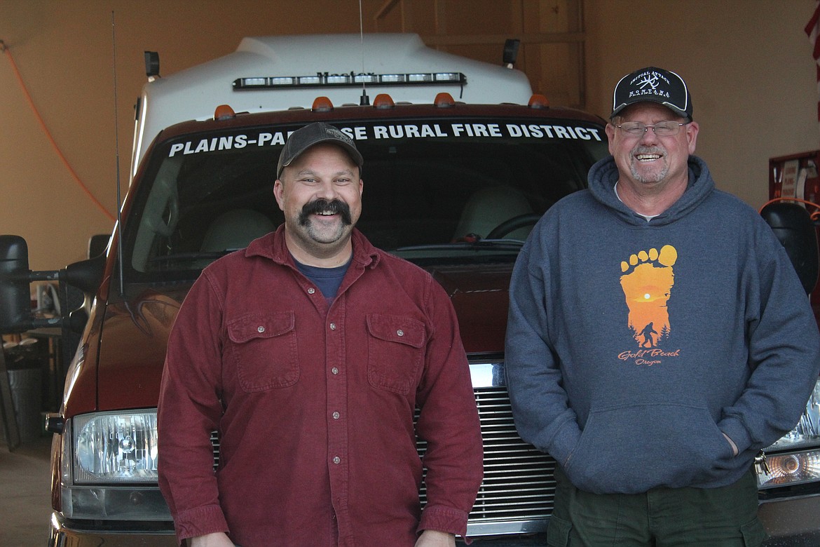 FIRE CHIEF James Russell and Captain Brian Reed standing in front of the Rural Fire Department building. (John Dowd/Clark Fork Valley Press)