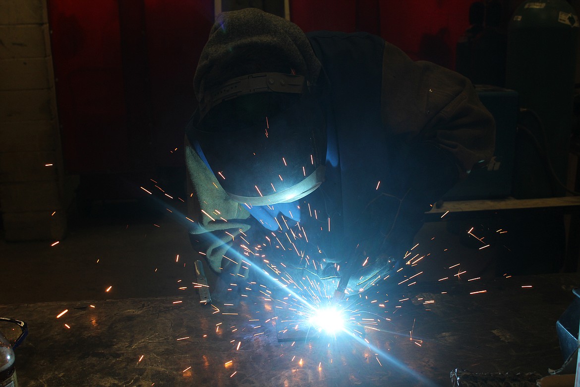 ANDREW HARMON, an 18-year-old senior, shows off his welding skills. (John Dowd/Clark Fork Valley Press)