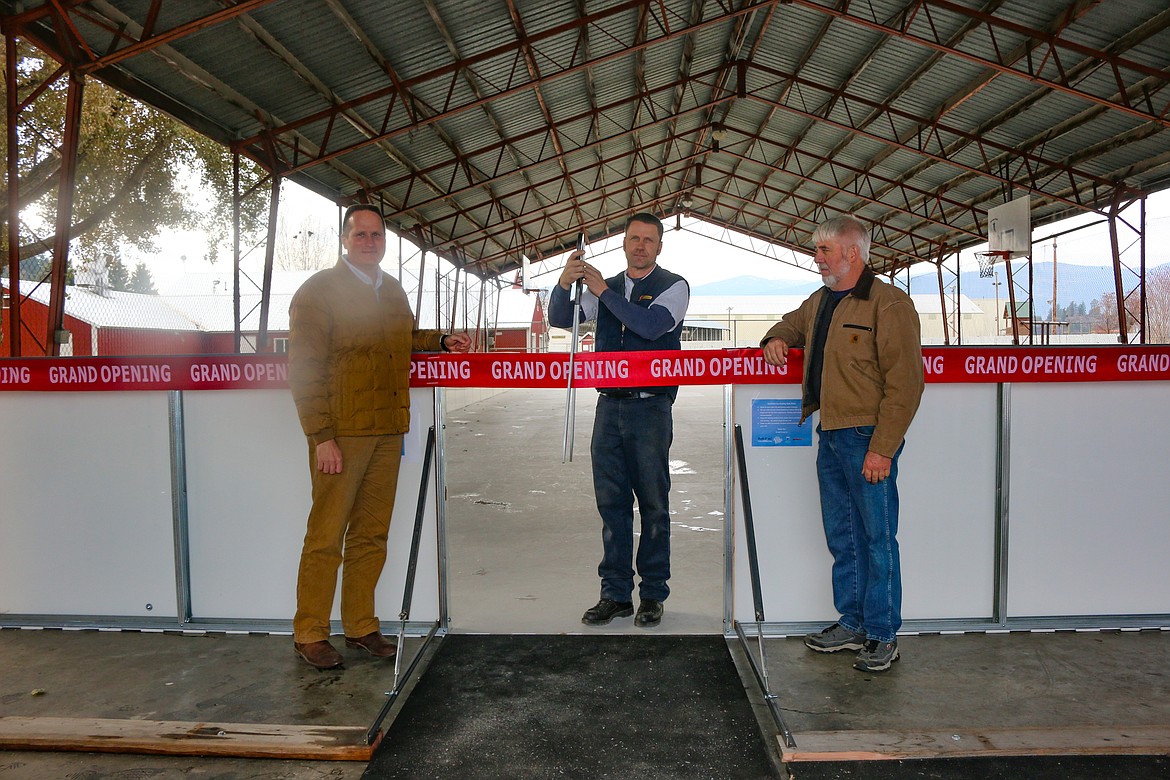 Photo by MANDI BATEMAN
Bonners Ferry Mayor David Sims,  Rob Tompkins with Boundary County Parks and Recreation, and Boundary County Commissioner, Wally Cossairt, cutting the ribbon at the grand opening of the new ice rink.