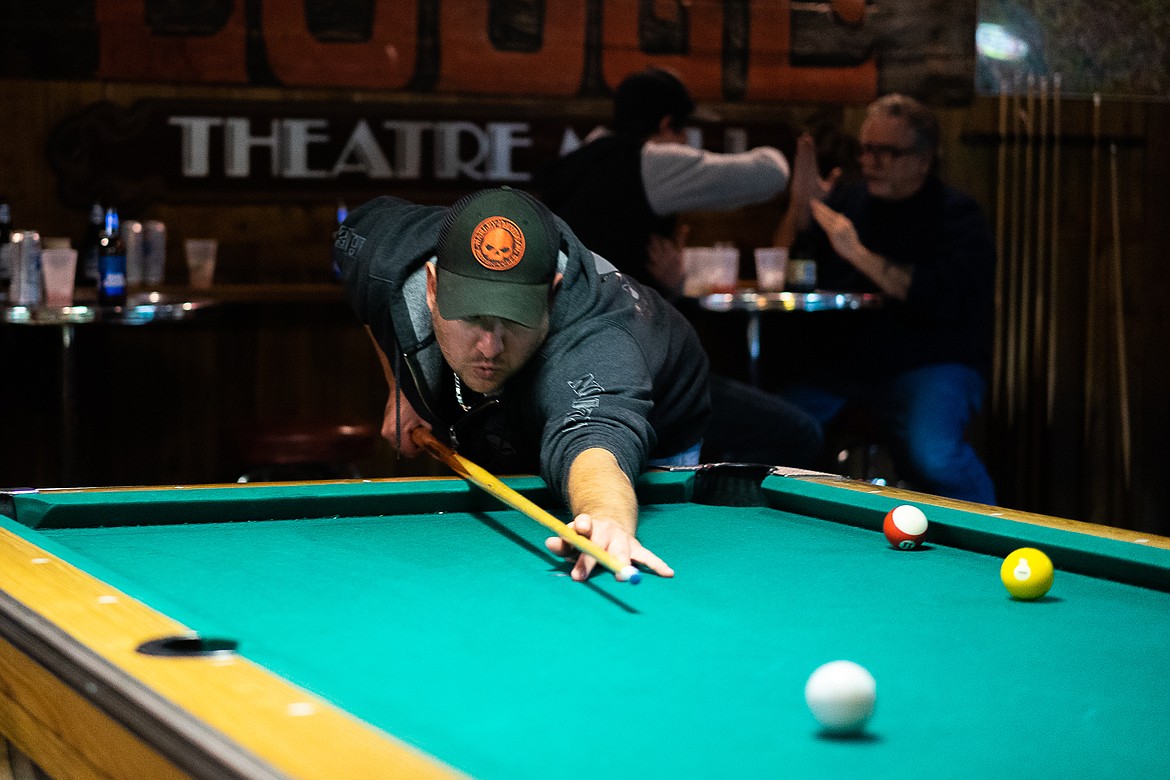 A Great Northern patron fires a shot in a game of pool during the Great Northern Bar and Grill&#146;s 100th anniversary celebration on Saturday. (Daniel McKay/Whitefish Pilot)